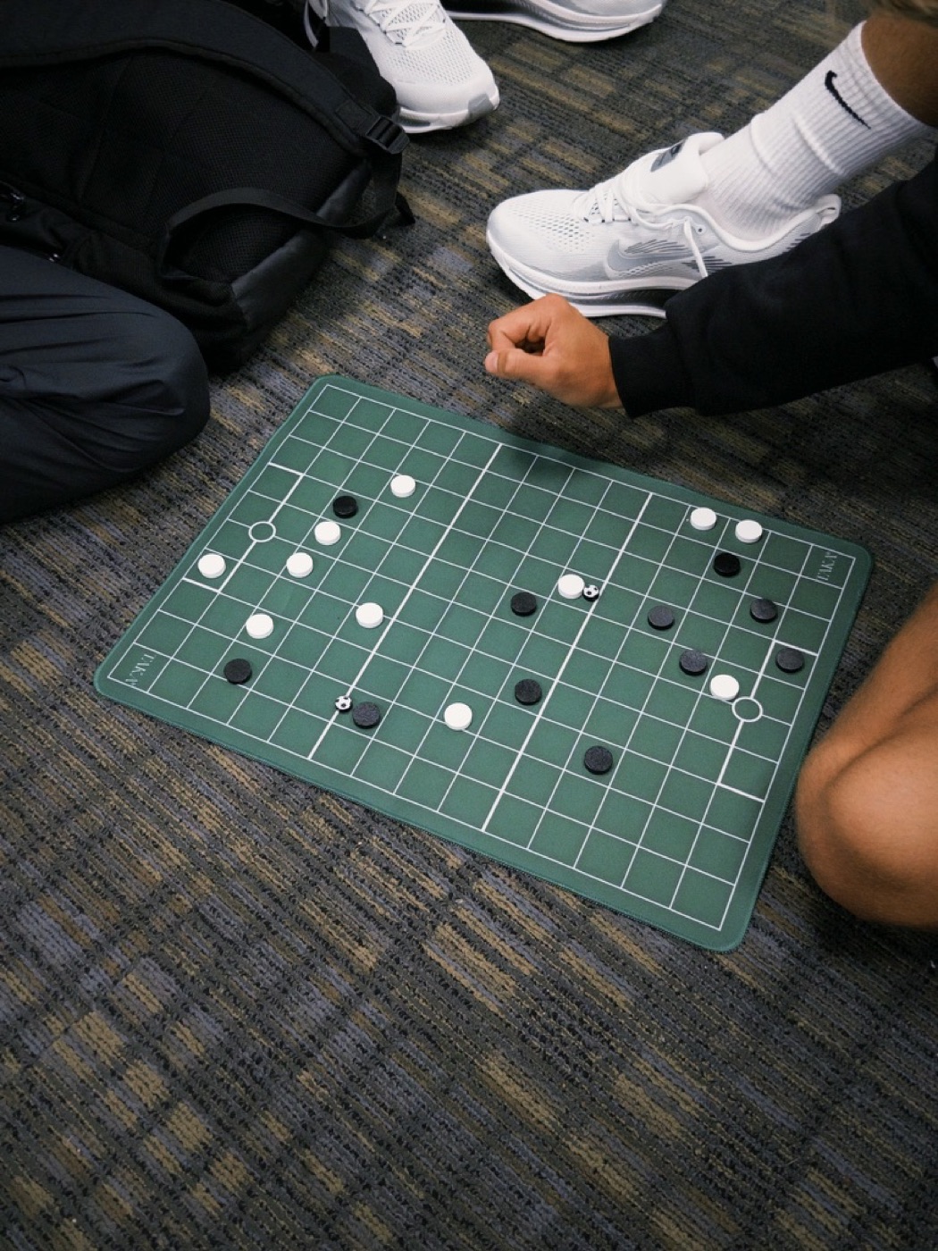 A TAKA match in progress on the green board mat